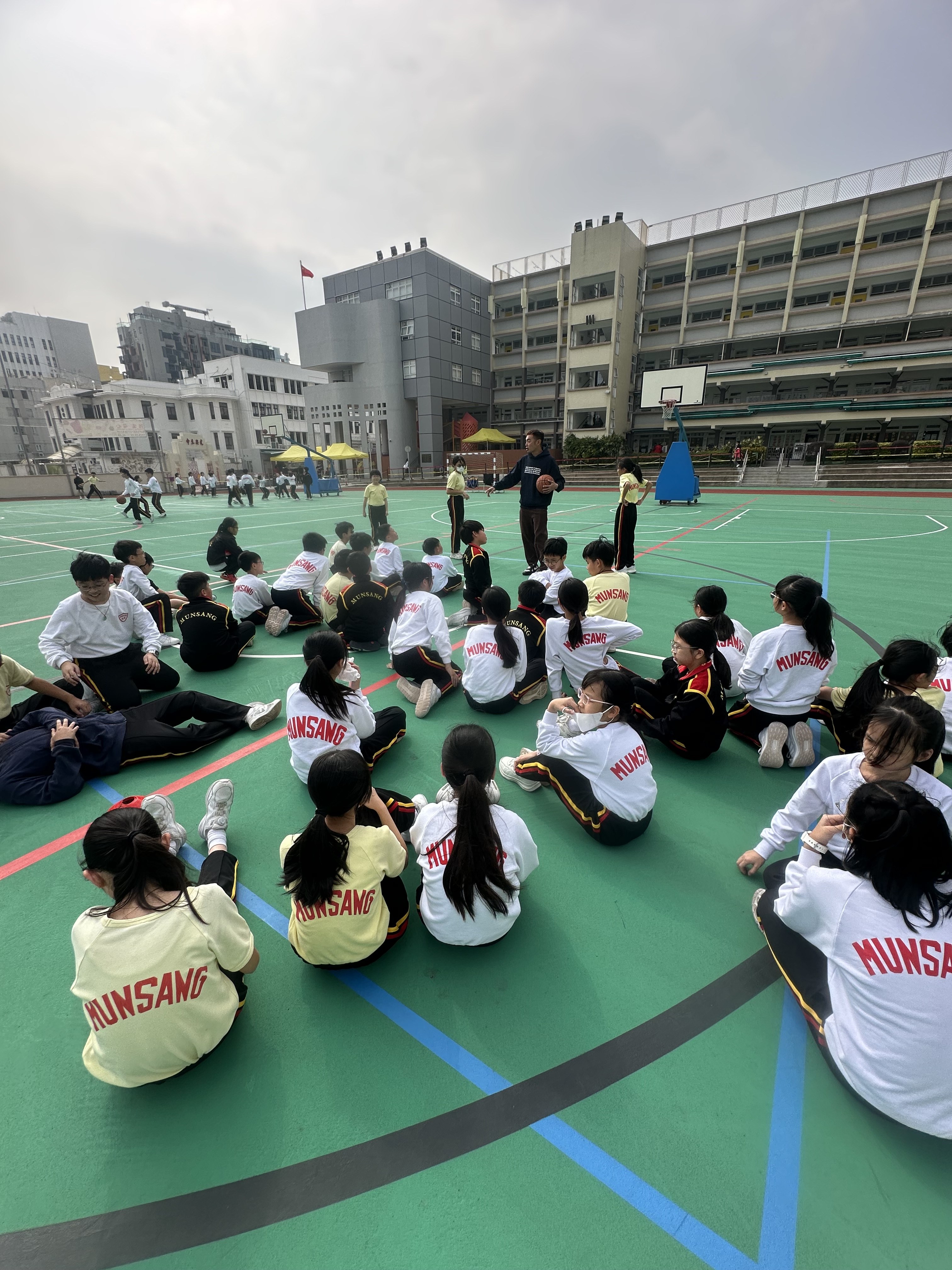 Whole-class gathering on the basketball court